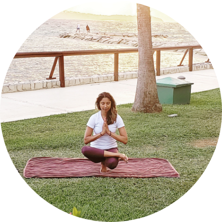 Raman Magay holding a yoga pose in an outdoor setting